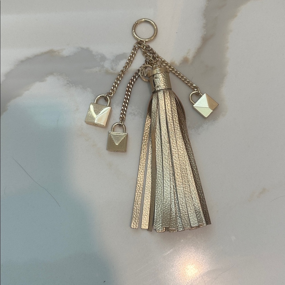 Michael Michael kors leather charm tassel gold